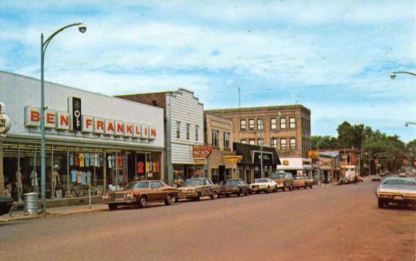 Iron River Michigan Genesee Street Scene Store Fronts Vintage Postcard K99883