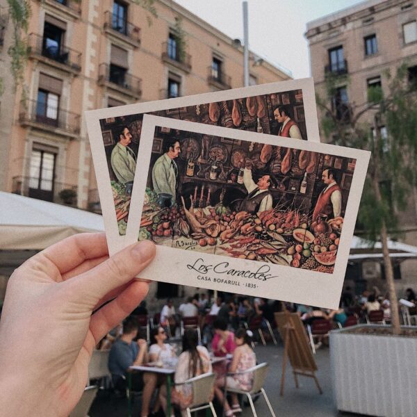 Person holding postcards