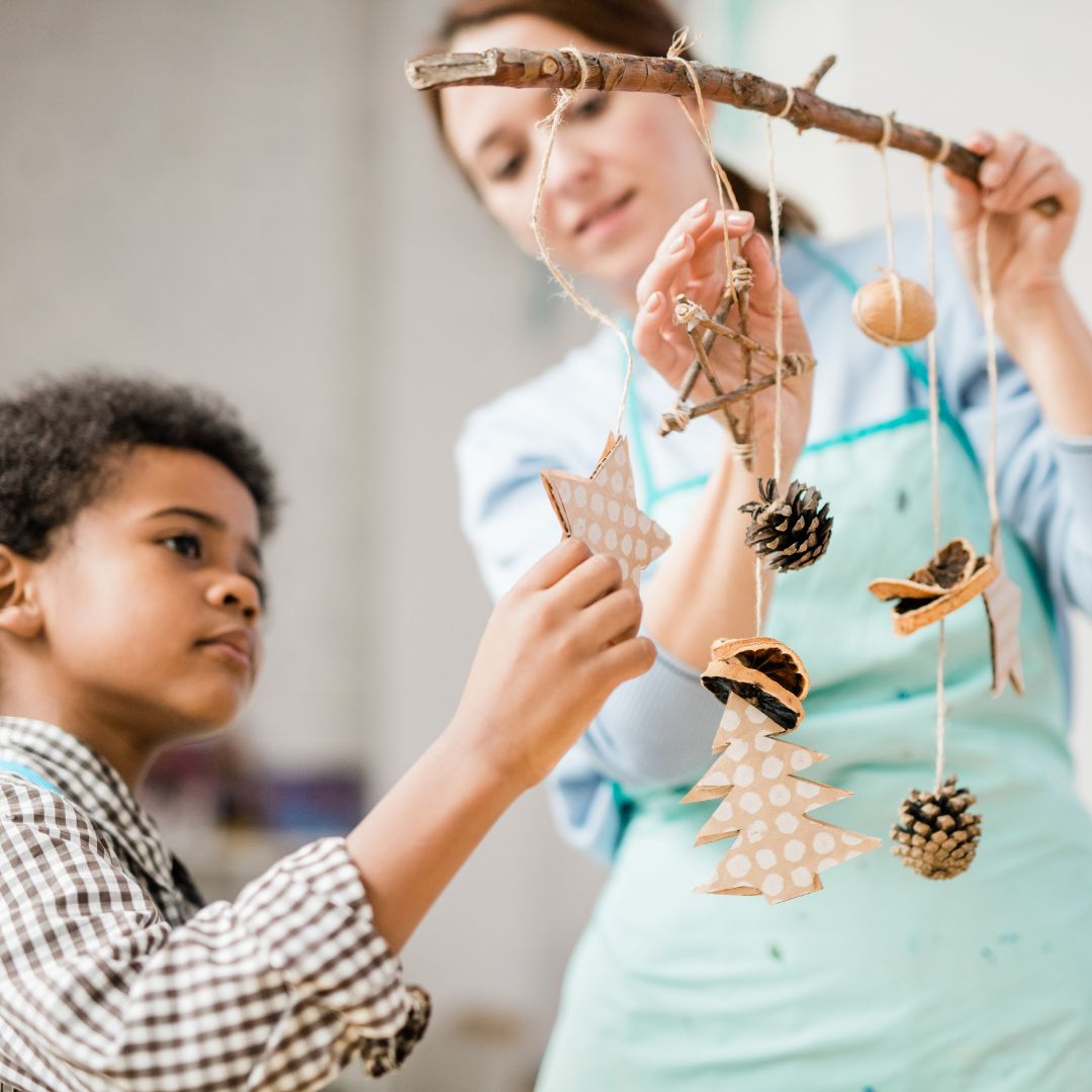 mother and son making a mobile