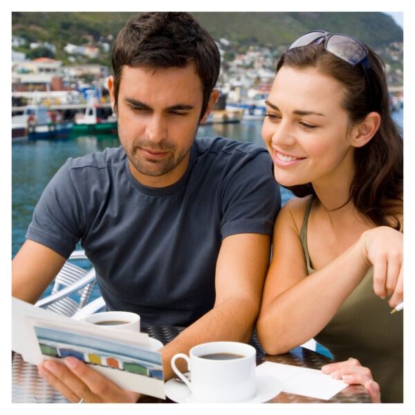 People looking at a postcard