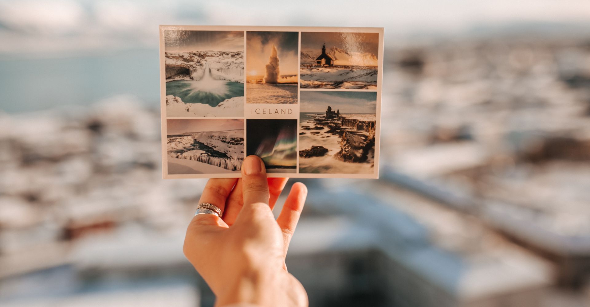 person holding a postcard