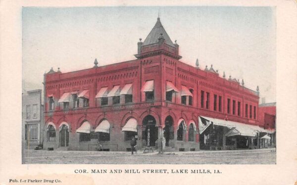 Lake Mills Iowa Corner of Main st and Mill St Vintage Postcard AA94639