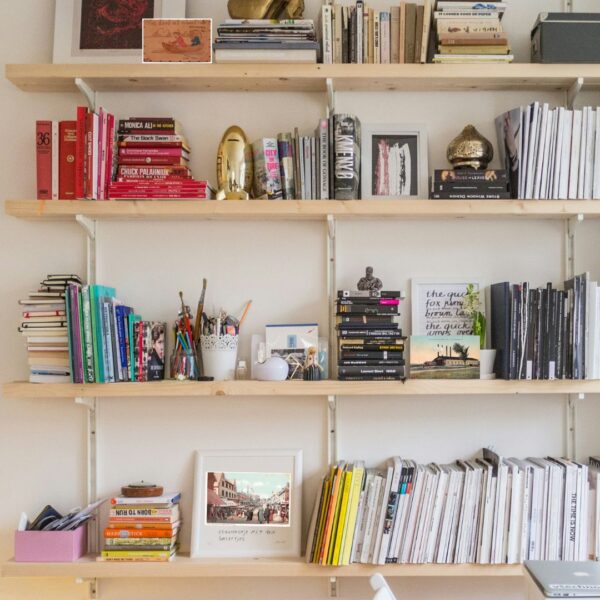 postcards on bookshelf