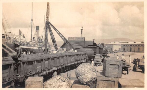 Dock Scene Loading Train with Supplies from Steamer Ship Real Photo PC AA94064