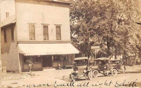 Lowell Indiana Cars Parked Outside Hotel Water Pump Real Photo Postcard AA95259