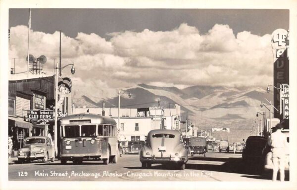 Anchorage Alaska Main Street Bus and Cars Real Photo Postcard AA95400