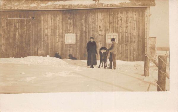 Cumberland Wisconsin People on Farm with Cow in Winter Real Photo PC AA96912