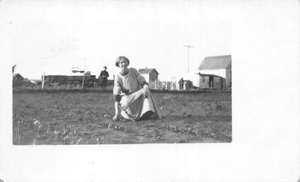 Saskatchewan Canada Woman planting Seeds on Farm Real Photo Postcard AA92034